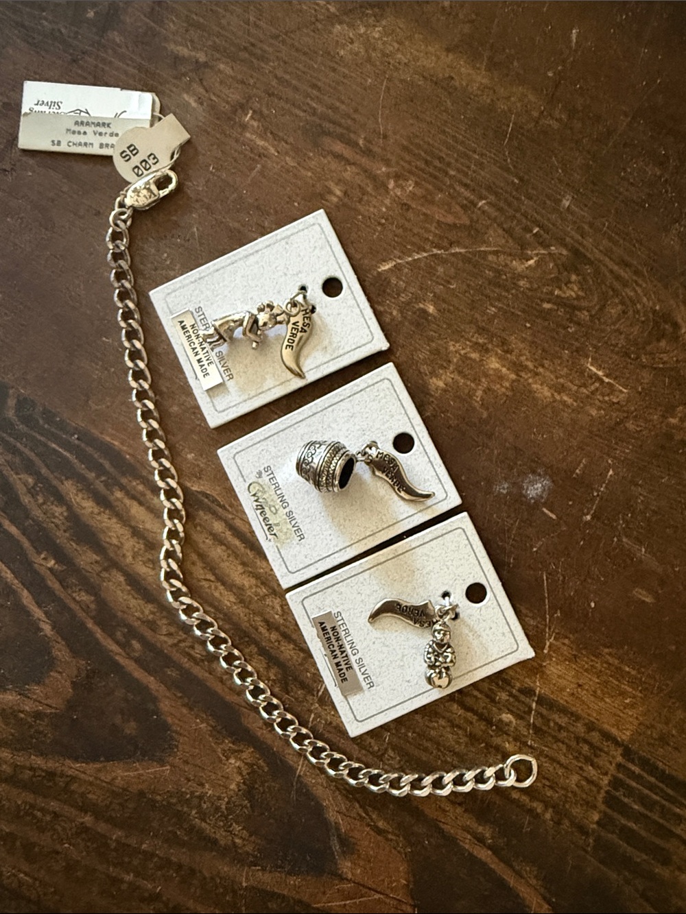 Vintage with original tags. Sterling Silver Charm Chain with 3 Silver Charms